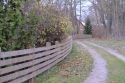 Photo wallpaper Road along the fence